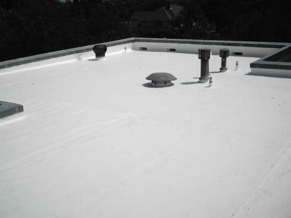 An image of TPO system been installed on the roof