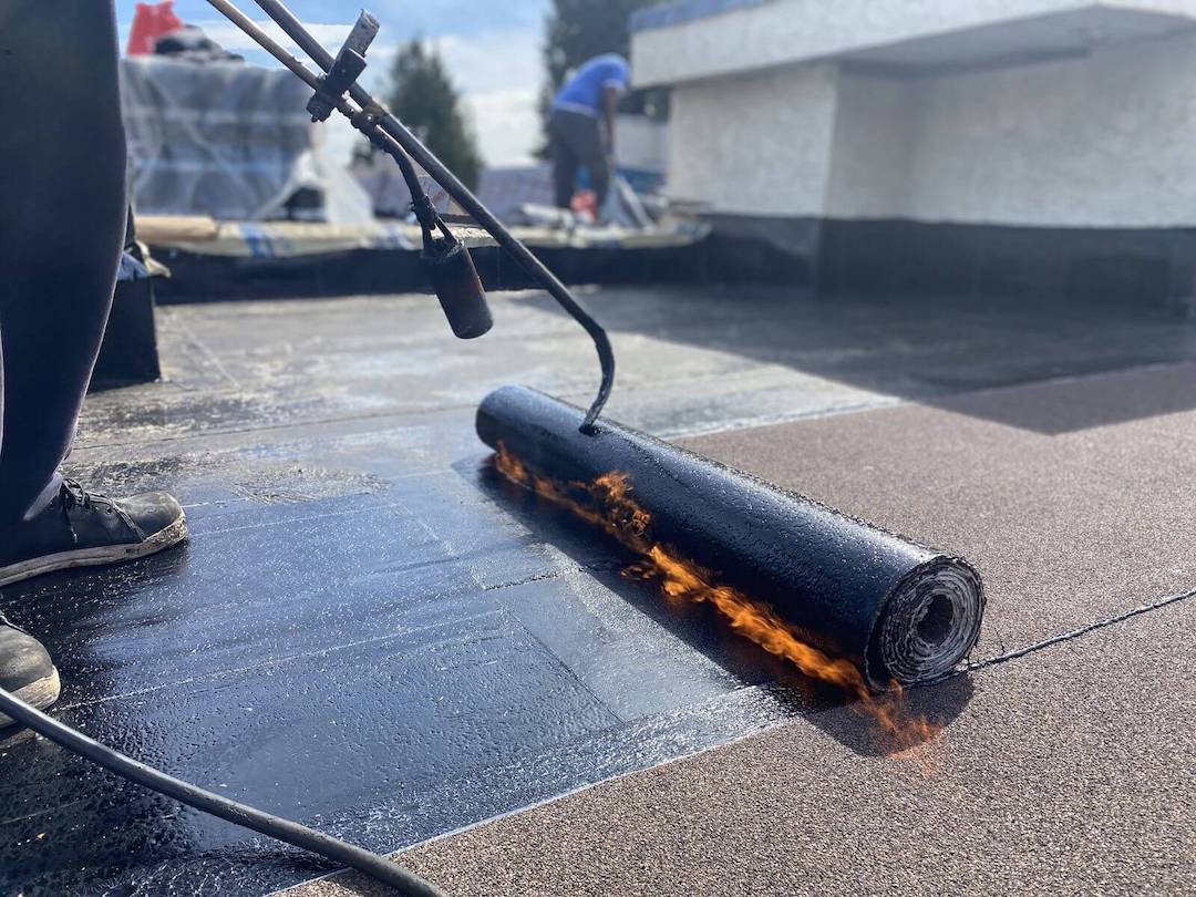 A commercial roofing service of Torch on roof in Vancouver